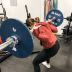 how to fix rounding of the back in the squat